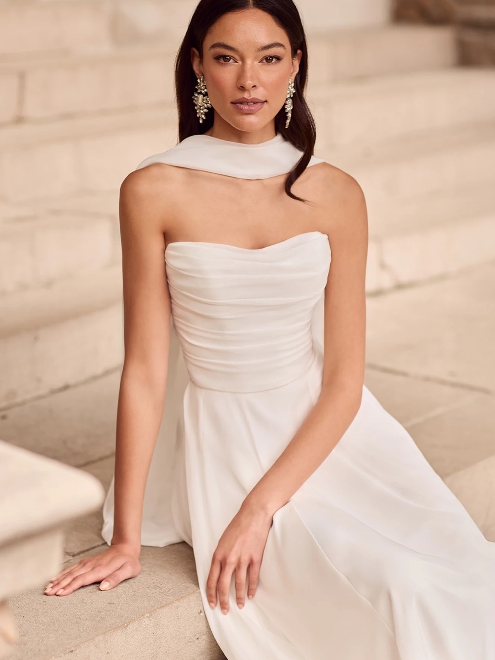 Style P5177
Paloma Blanca Elegant White Strapless Chiffon wedding dress